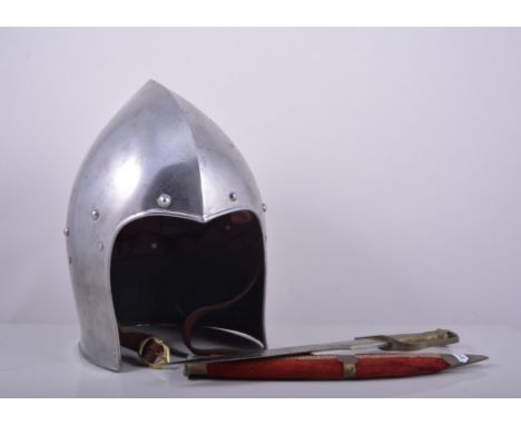 Steel helmet, Eastern knife, cast brass figure of a Knight and copper horn.