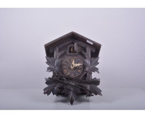 Carved wood cuckoo clock, double weight driven movement, case 27cm.