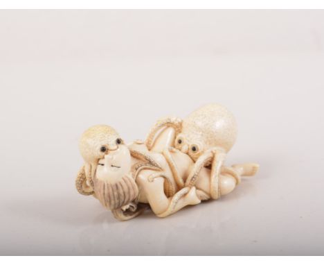 Japanese carved ivory erotic Netsuke, perhaps Meiji, modelled with a reclining figure and octopuses.