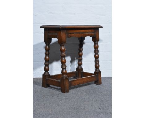 Reproduction joined oak stool, bobbin moulded legs, width 47cm.