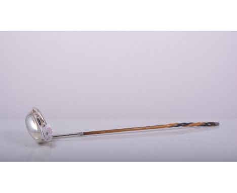 George III silver toddy ladle, London probably 1809, boat shape bowl with engraved crest and initials, twisted whale bone han