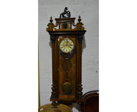 Victorian walnut Vienna wall clock, architectural pediment with a rearing horse surmount and mask head, brass dial with ivori