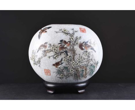 A Chinese crackle glazed moon vase, 20th centuryPainted in colours with birds amid flowering prunus branches, the glaze suffu