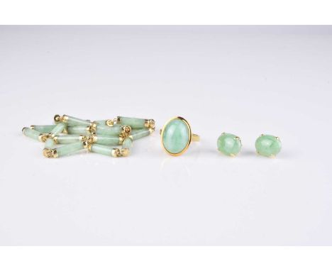 A yellow metal mounted jade necklace, designed as polished jade baton links mounted in yellow metal with character clasp, sta