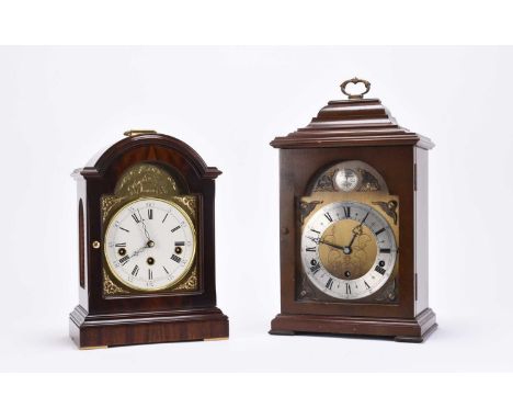 Two English reproduction bracket clocksThe first Elliott of London, the mahogany veneered case with bell top and brass carryi