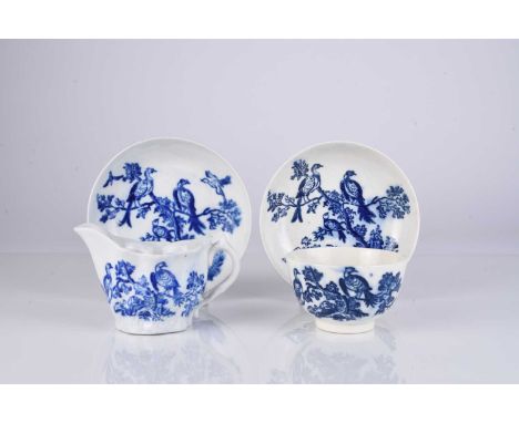 A Caughley 'Birds in Branches' porcelain tea bowl and saucer, circa 1780-85, transfer-printed in underglaze blue, unmarked, s