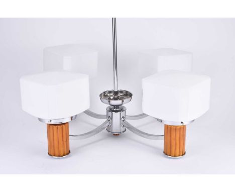 An Art Deco style four-branch ceiling lightThe lamp heads on reeded 'amber' cylinders and with cuboid white opalescent glass 