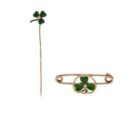 the stick pin topped by a green enamelled shamrock with a central split pearl, length 5.7cm, unmarked, tested as 9ct gold, ca