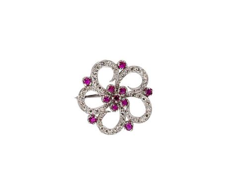central cluster of six round faceted rubies, surrounded by five pierced petals set with single cut diamonds, estimated approx