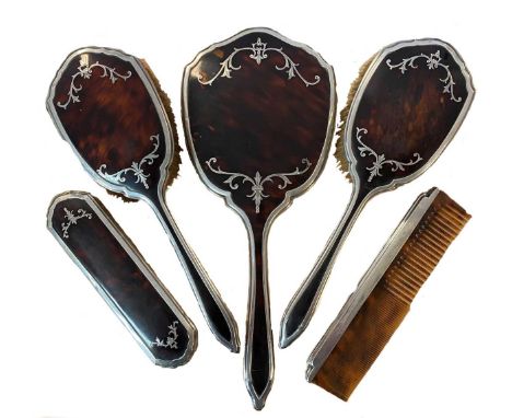 mark of Barker Brothers Silver Ltd, Birmingham 1930/34, comprising hand mirror, two hairbrushes, clothes brush and comb, the 