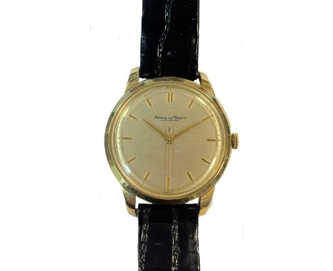circa 1950, the signed circular cream coloured dial, 30mm diameter, with gold coloured batons, hands and centre sweep, signed