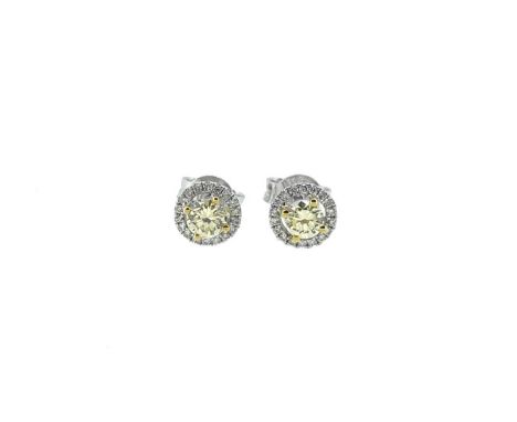 each with a claw set central light yellow round brilliant cut diamond, average diameter 3.7mm, surrounded by a halo of white 