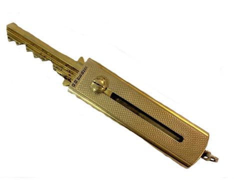 mark of S J Rose &amp; Son, London 1956, of rectangular form, decorated all over with engine turned engraving, one side with 