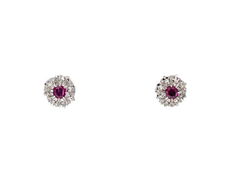 each with a claw set round faceted ruby, diameter 3.5mm, estimated approximate total weight 0.40ct, surrounded by eight claw 