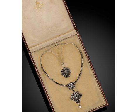 circa 1890, the centrepiece necklace, comprising two parts, both with a delicate openwork scroll design set with French cut d