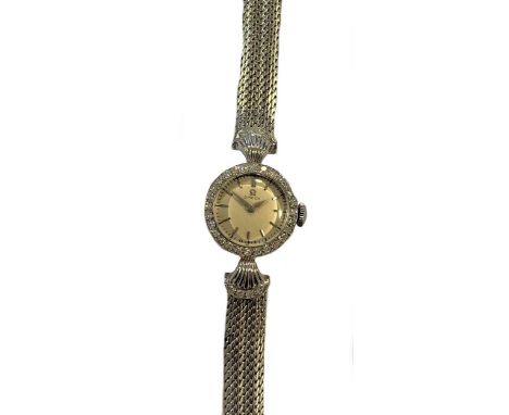 circa 1959, the signed, circular silvered dial, 14mm diameter, with silver coloured batons and hands and black baton minute t