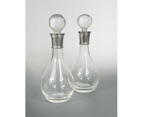 each with mark of R. Carr, Sheffield 2004, of pear shaped form, the ground stopper topped with a ball, signed silver collar, 