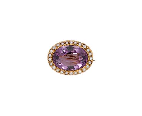 oval faceted amethyst, approximately 18.1 x 13.3mm, estimated approximate weight 12.00ct, surrounded by a border of cut down 