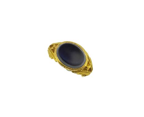 of oval form, 15 x 11.5mm, closed setting, plain polished grooved surround with ornately carved shoulders and shank, approxim
