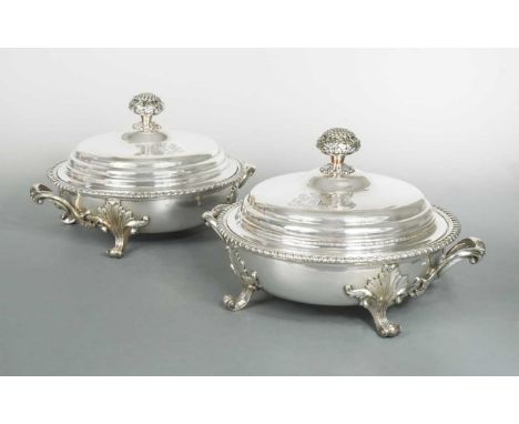 each of circular form with reeded rim and two applied handles, removable inner with gadrooned rim, stepped cover engraved twi
