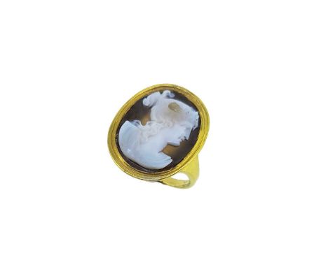 depicting a portrait of a female, white on a brown ground, possibly 18th century in a later mount, head dimensions 24 x 9mm, 