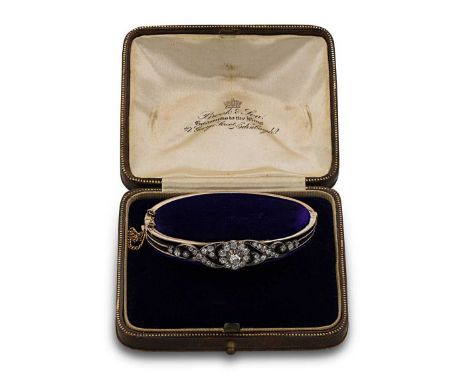 central old European cut diamond, held within a white metal cut down setting, diameter 4.3mm, surrounded by ten old brilliant