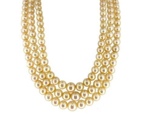 three rows of graduating light cream, off-round cultured pearls, graduating from 6 to 9.1mm, strung knotted to a floral featu