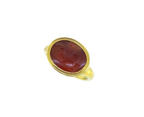 of oval form, depicting a horse and rider, possibly Roman, approximately 14.5 x 11.5mm, held within a grooved rubover closed 