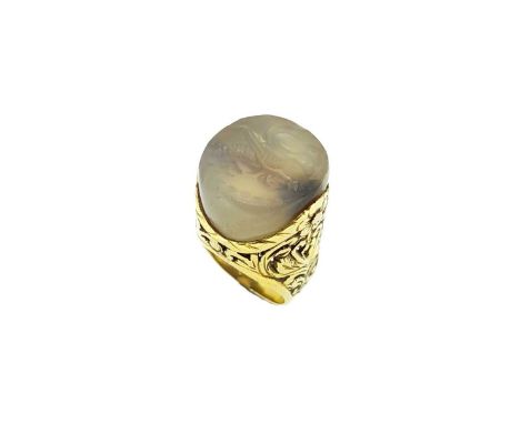round agate depicting Pegasus, approximate diameter 18mm, held within an ornately carved mount with floral pattern, plain sha
