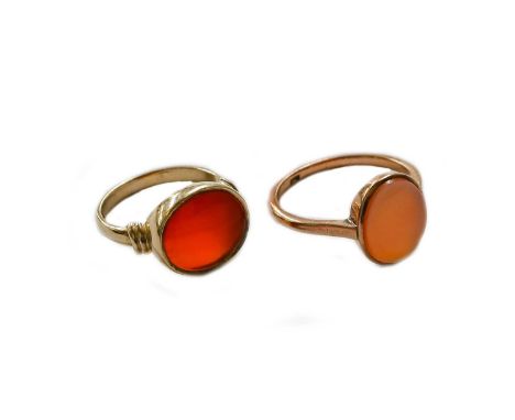 A 9 carat gold hardstone signet ring, finger size M; and another hardstone signet ring, stamped '9CT', finger size SGross wei