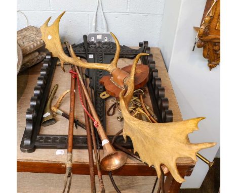 A pair of mounted antlers, a copper coaching horn, various riding crop, a oak wall mounting stick rack, etc 