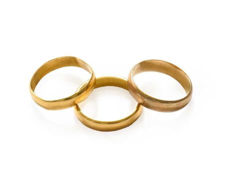 Two 22 carat gold band rings, finger sizes O and P; and a 9 carat gold band ring, finger size MTwo 22 carat gold rings - 7.1 