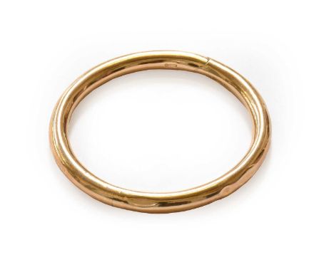A 9 carat gold bangle, inner measurement 5.6cm diameterGross weight 11.1 grams.