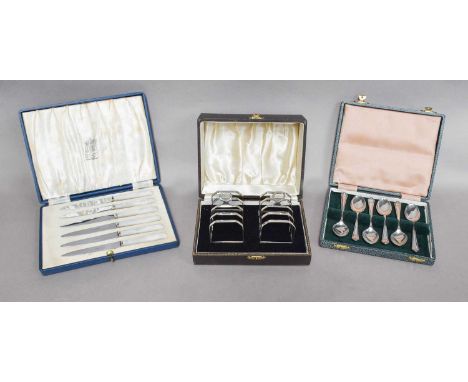 A Collection of Cased Sets of Silver Flatware, including: three cased sets of six tea or coffee-spoons, one set with a pair o