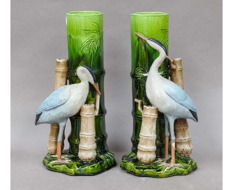 A pair of Bretby aesthetic movement vases, each surmounted by a crane, impressed marks, 29.5cm high Both vases heavily crazed
