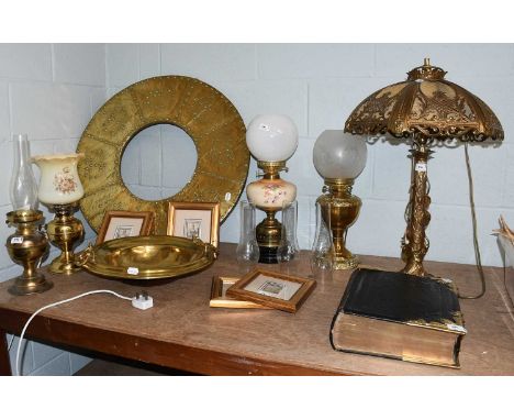 A 19th century brass brazier with wide stud work border, 76cm diameter; together with four brass base oil lamps (3 converted)