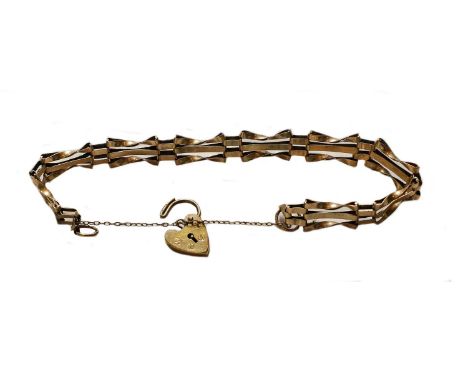 A pair of 9 carat gold cufflinks; a 9 carat gold gate link bracelet, length 18.2cm; a fob ring supporting five charms compris