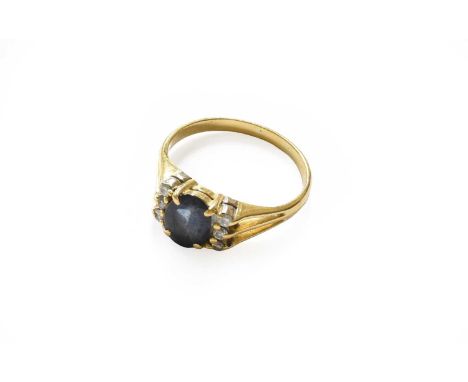 A sapphire and diamond ring, finger size OThe ring is in good to fair condition, with abrasion and a chip to the sapphire. It