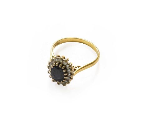 An 18 carat gold sapphire and diamond cluster ring, finger size QThe ring is in good condition with slight surface abrasion t