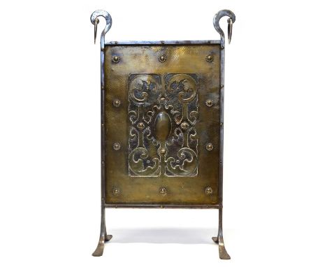 Arts &amp; Crafts brass &amp; wrought steel fire screen on four splayed feet with central symmetrical hammered repoussé desig