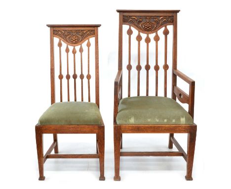 Eight mid 20th century Art &amp; Crafts style oak dining chairs to include 6 standard chairs and 2 carvers. The chairs have a