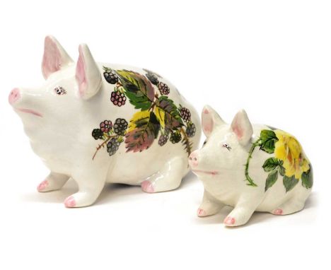 Two Wemyss pigs in bramble with 'EXON 1555 Wemyss Esther Weeks' to the underside and yellow rose pattern with 'Wemyss EXON 23