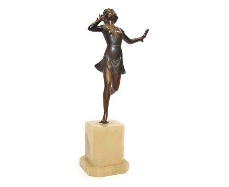 Art deco spelter figure of a clothed female dancer in a dress on a white onyx base, 36cm high.