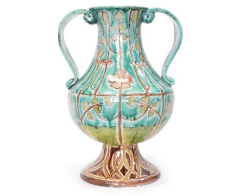 Early 20th Century Della Robbia twin handled footed vase applied scroll handles, decorated by Tom Hall and Percy Jacques. The