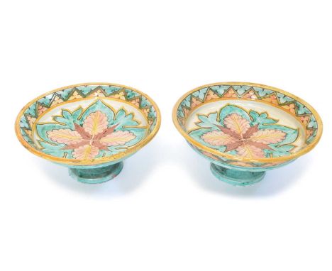 Pair of early 20th Century Della Robbia footed dishes or tazza, decorated by Gertrude Russell. The dishes are incised and pai