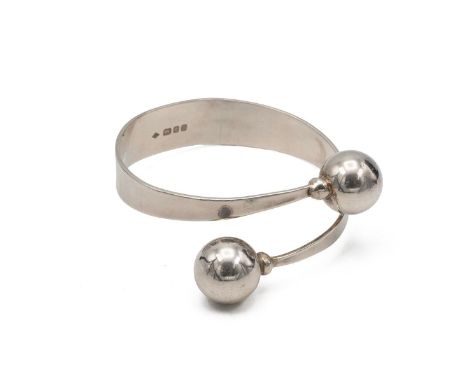 Graham Watling, a silver cuff bangle with bead end finials, London 1968, 40.5 grams.