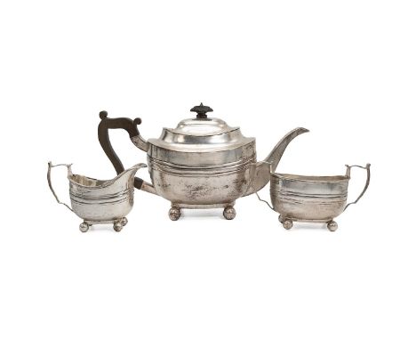 Sterling silver three-piece tea service, teapot creamer and sugar bowl. Manoah Rhodes &amp; Sons Ltd, hallmarked for London c