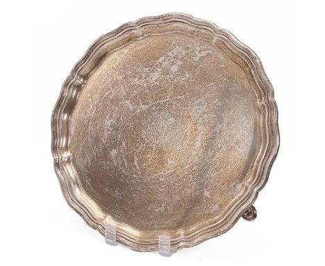 Scottish silver salver with fluted rim raised on three horse shoe style supports, hallmarked Edinburgh 1934, maker Mackay and