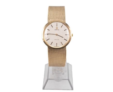 9ct gold Omega De Ville gents wristwatch. Manual wind, 28mm case, silvered dial, gold baton indices, woven design bracelet, O