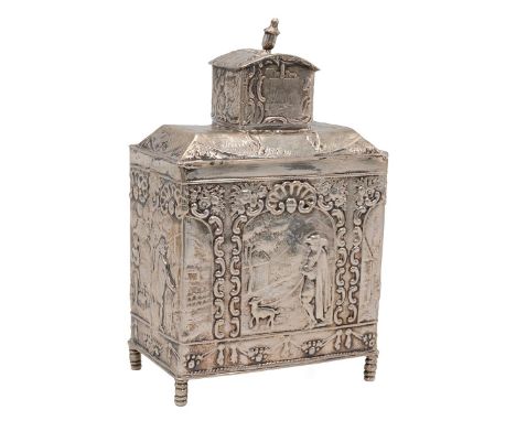 Dutch silver tea caddy on four turned supports with heavily embossed decoration and turned finial to the lid. Weight 97 grams